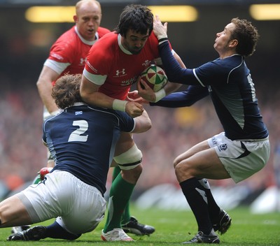 13.02.10 - Wales v Scotland - RBS Six Nations 2010 - Jonathan Thomas of Wales is tackled by Ross Ford and Dan Parks of Scotland. 