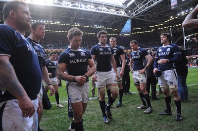 13.02.10 - Wales v Scotland - RBS Six Nations 2010 - Chris Cusiter of Scotland looks dejected as he leads his players off the field. 