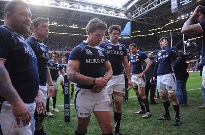 13.02.10 - Wales v Scotland - RBS Six Nations 2010 - Chris Cusiter of Scotland looks dejected as he leads his players off the field. 