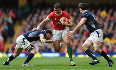 13.02.10 - Wales v Scotland - RBS Six Nations 2010 - Jamie Roberts of Wales holds off Graeme Morrison of Scotland. 