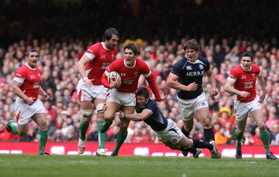 13.02.10 Wales v Scotland... James Hook is tackled by  Scotland's Chris Cusiter. .