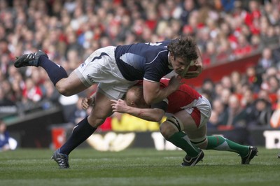 13.02.10 Wales v Scotland - RBS 6 Nations -  Scotland's Alasdair Dickenson is tackled Wales' Martyn Williams. 