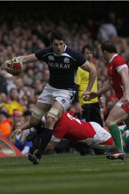 13.02.10 Wales v Scotland - RBS 6 Nations -  Scotland's John Beattie skips past Wales' Gareth Williams as Shane Williams closes in. 