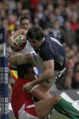 13.02.10 Wales v Scotland - RBS 6 Nations -  Scotland's John Beattie is tackled by Wales' Lee Byrne. 