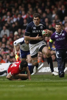 13.02.10 Wales v Scotland - RBS 6 Nations -  Scotland's Sean Lamont skips through the tackle of Wales' Leigh Halfpenny. 