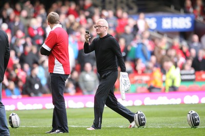 13.02.10 Wales v Scotland... Radio 2 DJ Chris Evans uses his phone to take pictures while on the pitch of the Millennium Stadium during half time. .