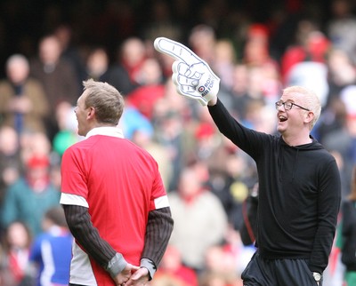 13.02.10 Wales v Scotland... Radio 2 DJ Chris Evans points to the crowd while on the pitch of the Millennium Stadium during half time. .