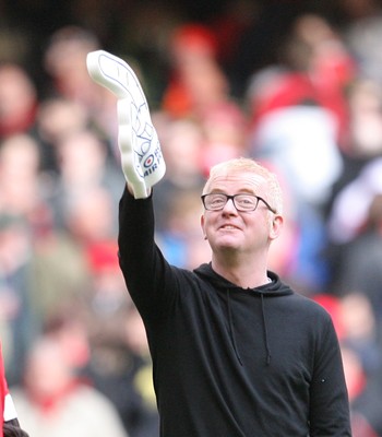 13.02.10 Wales v Scotland... Radio 2 DJ Chris Evans points to the crowd while on the pitch of the Millennium Stadium during half time. .