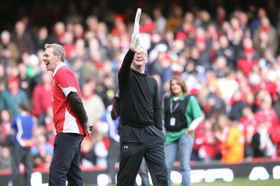 13.02.10 Wales v Scotland... Radio 2 DJ Chris Evans points to the crowd while on the pitch of the Millennium Stadium during half time. .