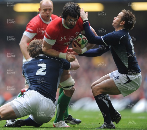 13.02.10 - Wales v Scotland - RBS Six Nations 2010 - Jonathan Thomas of Wales is tackled by Ross Ford and Dan Parks of Scotland. 