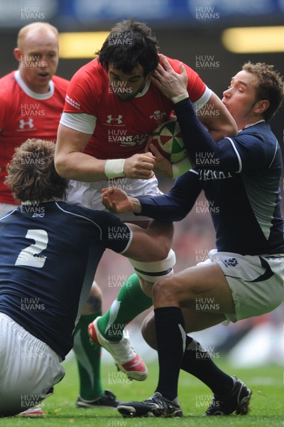 13.02.10 - Wales v Scotland - RBS Six Nations 2010 - Jonathan Thomas of Wales is tackled by Ross Ford and Dan Parks of Scotland. 