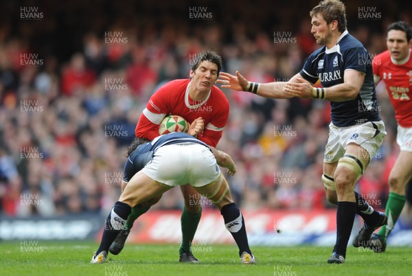 13.02.10 - Wales v Scotland - RBS Six Nations 2010 - James Hook of Wales is tackled by Max Evans of Scotland. 