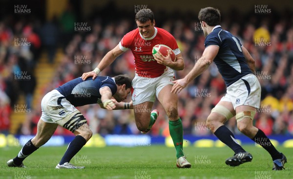 13.02.10 - Wales v Scotland - RBS Six Nations 2010 - Jamie Roberts of Wales holds off Graeme Morrison of Scotland. 