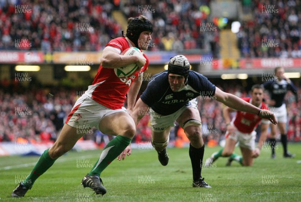 13.02.10 Wales v Scotland... Leigh Halfpenny runs in to score try past Scotland's Kelly Brown.