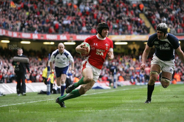 13.02.10 Wales v Scotland... Leigh Halfpenny runs in to score try past Scotland's Kelly Brown.