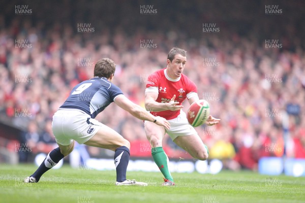 13.02.10 Wales v Scotland... Wales' Shane Williams is closed down by Scotland's Chris Cusiter. 