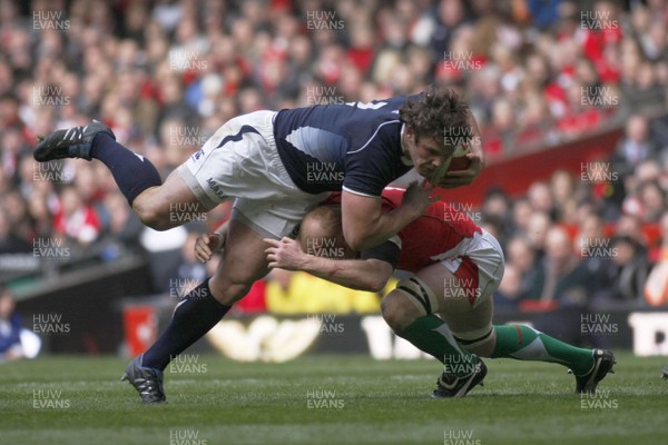 13.02.10 Wales v Scotland - RBS 6 Nations -  Scotland's Alasdair Dickenson is tackled Wales' Martyn Williams. 