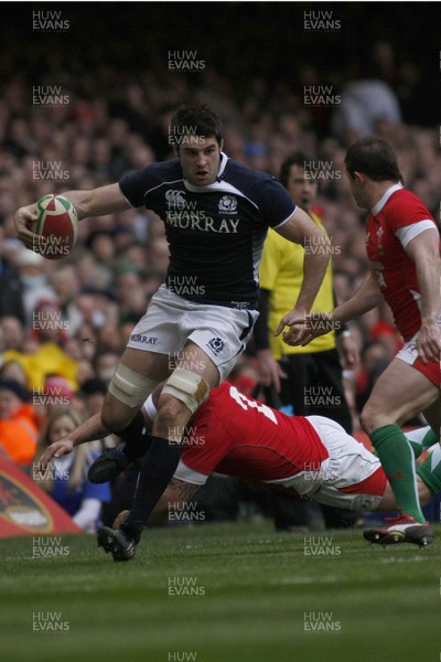 13.02.10 Wales v Scotland - RBS 6 Nations -  Scotland's John Beattie skips past Wales' Gareth Williams as Shane Williams closes in. 