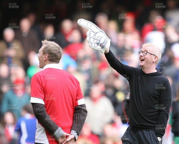 13.02.10 Wales v Scotland... Radio 2 DJ Chris Evans points to the crowd while on the pitch of the Millennium Stadium during half time. .
