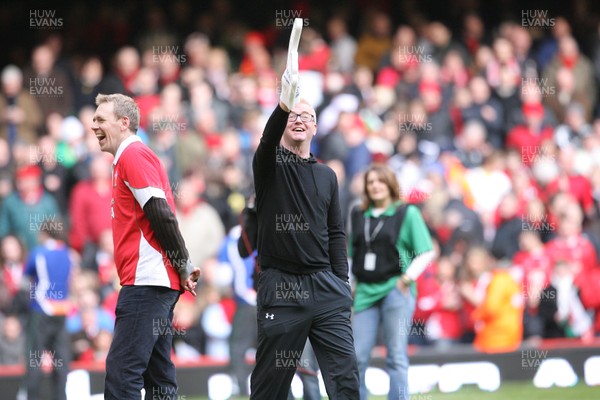 13.02.10 Wales v Scotland... Radio 2 DJ Chris Evans points to the crowd while on the pitch of the Millennium Stadium during half time. .