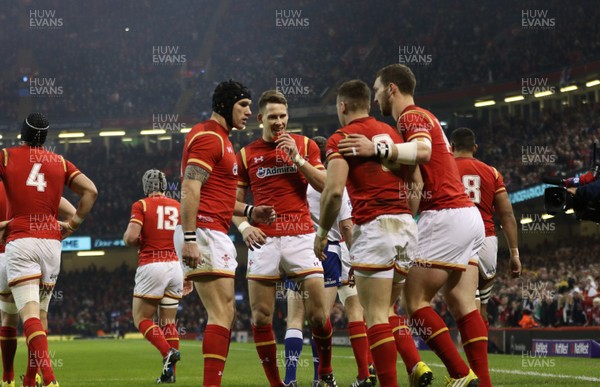 130216 - Wales v Scotland, RBS 6 Nations 2016 - Tom James of Wales, Liam Williams of Wales and George North of Wales celebrate with Gareth Davies of Wales after he scores try