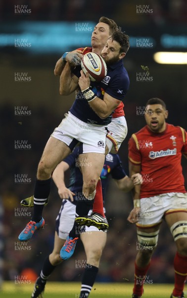 130216 - Wales v Scotland, RBS 6 Nations 2016 - Sean Maitland of Scotland takes the ball as Liam Williams of Wales challenges