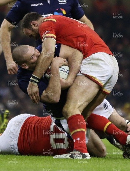 130216 - Wales v Scotland, RBS 6 Nations 2016 - Gordon Reid of Scotland is tackled by Dan Lydiate of Wales and Jamie Roberts of Wales