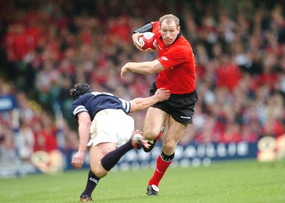 14-02-04. Wales v Scotland RBS Six Nations. Wales' Gareth Thomas gets past Tom Philip  Pic: James Davies/