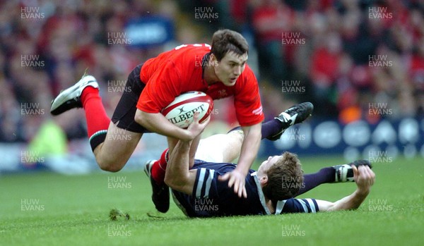 14-02-04. Wales v Scotland RBS Six Nations. Wales'  Iestyn Harris is toppled by Andrew Henderson.  Pic: James Davies/