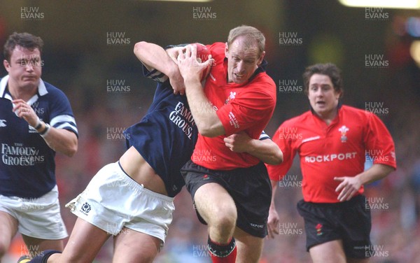 14.02.04  Wales v Scotland  Gareth Thomas is tackled by Ben Hinshelwood  Huw Evans,Cardiff