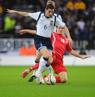 14.11.09 - International Football Friendly, Wales v Scotland Scotland's Graham  Dorrans is tackled by Wales' Aaron Ramsey 
