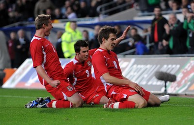 14.11.09 - International Football Friendly, Wales v Scotland Wales' Aaron Ramsey (R) celebrates scoring his sides third goal with Simon Church and Gareth Bale 