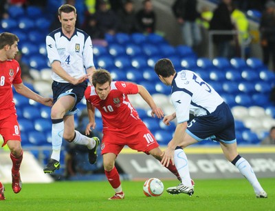 14.11.09 - International Football Friendly, Wales v Scotland Wales' Aaron Ramsey tries to get between Scotland's Stephen McManus and Gary Caldwell 