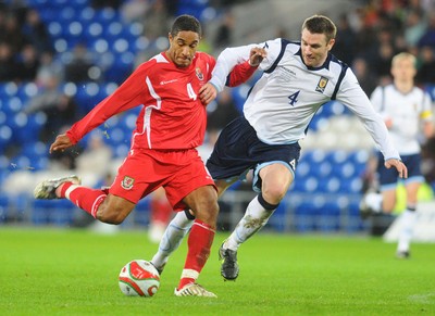 14.11.09 - International Football Friendly, Wales v Scotland Wales' Ashley Williams is challenged by Scotland's Stephen McManus 