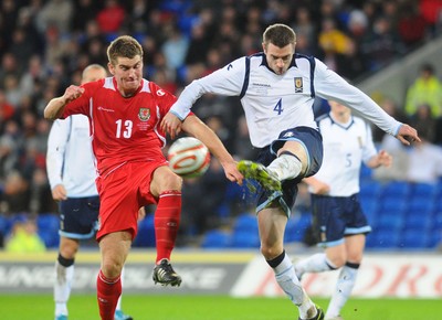 14.11.09 - International Football Friendly, Wales v Scotland Wales' Sam Vokes and Scotland's Stephen McManus compete 