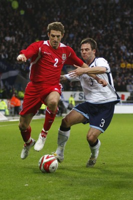 14.11.09  Wales v Scotland - International Football friendly - Wales' Sam Ricketts holds off the challengs of Daniel Fox. 