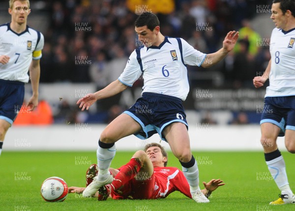 14.11.09 - International Football Friendly, Wales v Scotland Scotland's Graham  Dorrans is tackled by Wales' Aaron Ramsey 