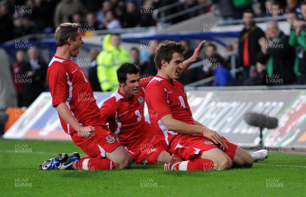 14.11.09 - International Football Friendly, Wales v Scotland Wales' Aaron Ramsey (R) celebrates scoring his sides third goal with Simon Church and Gareth Bale 