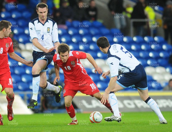 14.11.09 - International Football Friendly, Wales v Scotland Wales' Aaron Ramsey tries to get between Scotland's Stephen McManus and Gary Caldwell 