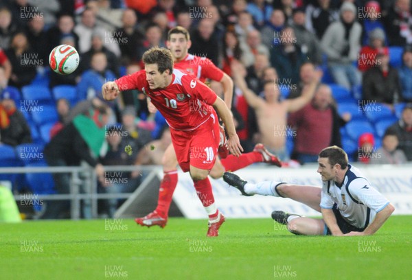 14.11.09 - International Football Friendly, Wales v Scotland Wales' Aaron Ramsey getas past Scotland's Stephen McManus 