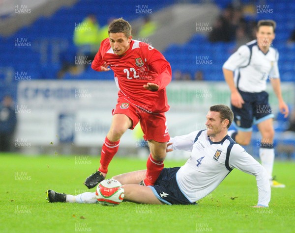 14.11.09 - International Football Friendly, Wales v Scotland Wales' Joe Allen is tackled by Scotland's Stephen McManus 