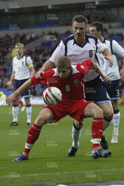 14.11.09  Wales v Scotland - International Football friendly - Wales' Simon Church holds off Stephen McManus. 