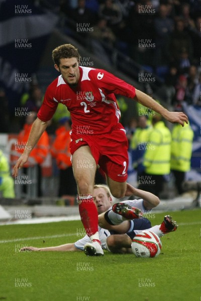 14.11.09  Wales v Scotland - International Football friendly - Wales' Sam Ricketts skips over the challenge of Steven Naismith. 