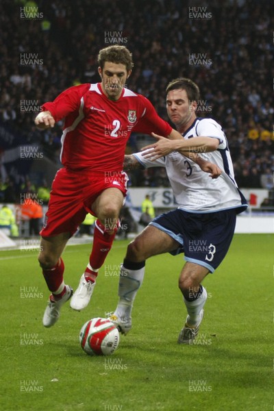 14.11.09  Wales v Scotland - International Football friendly - Wales' Sam Ricketts holds off the challengs of Daniel Fox. 