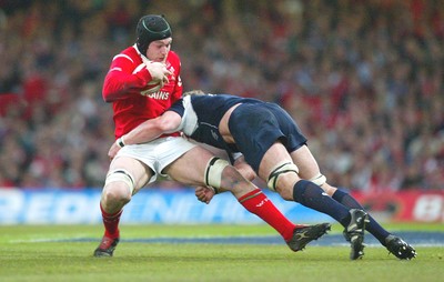 12.02.06..Wales v Scotland, Millennium Stadium, Cardiff Wales Michael Owen is tackled by Jason White 