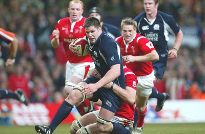 12.02.06..Wales v Scotland, Millennium Stadium, Cardiff Scotlands Allister Hogg is tackled by Robert Sidoli 