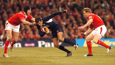 12.02.06 - Six Nations Rugby - Wales v Scotland Scotland's Hugo Southwell tries to get between Hal Luscombe and Matthew Watkins 
