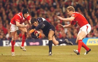 12.02.06 - Six Nations Rugby - Wales v Scotland Scotland's Hugo Southwell tries to get between Hal Luscombe and Matthew Watkins 