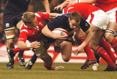 12.02.06 - Six Nations Rugby - Wales v Scotland Scotland's Andrew Henderson is brought down by Matthew Watkins 