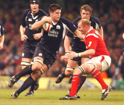 12.02.06 - Six Nations Rugby - Wales v Scotland Scotland's Allister Hogg tries to get past Martyn Williams 